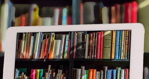 image of ipad taking photo of library shelves